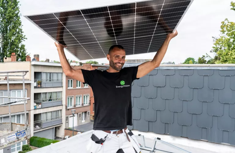Man holding solar panel
